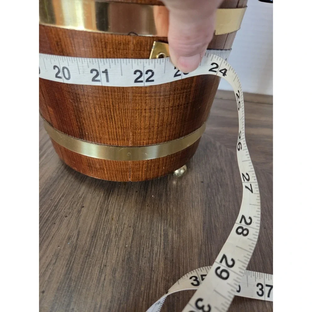 vintage Jerywil wood and brass-accented footed ice bucket from the 1970s